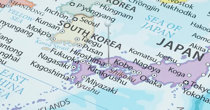 A zoom out of a white pin into hiroshima city of japan political map