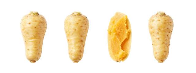 Photograph of four tan, speckled yams in a row . Third yam is split open, revealing orange flesh. All yams have green, fibrous tops.