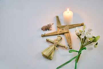 Brigid cross, snowdrops, and lamb celebrating imbolc