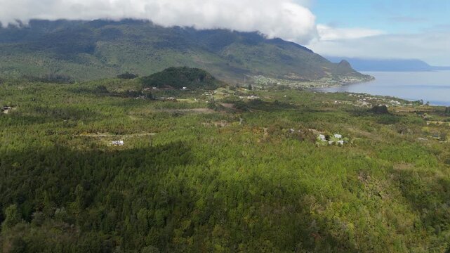 Panoramic Aerial View of Forest Bay and Cloudy Mountains