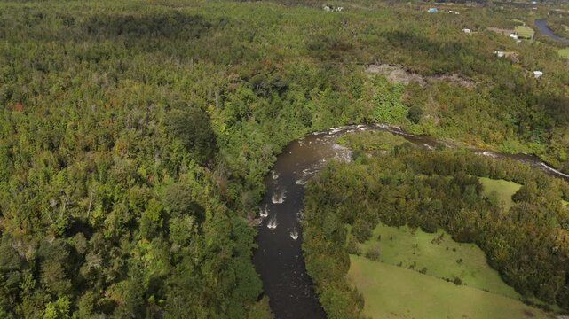 Aerial View of River Separating Forest and Valley Landscape