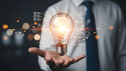 Businessman with innovative idea and glowing light bulb in hand