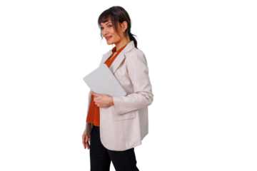 Confident businesswoman walking forward, holding a tablet under her arm and smiling, isolated on a transparent background