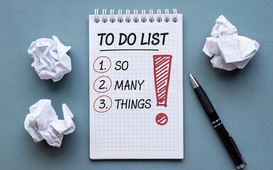 So Many Things To Do List Text on Notebook with Crumpled Paper Balls