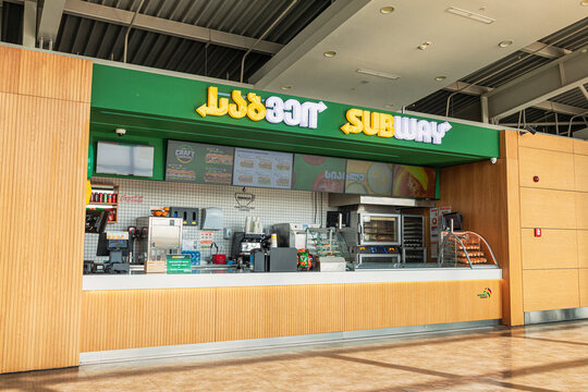 7 November 2025, Tbilisi, Georgia: Subway Fast food restaurant interior showing the service counter, menu board, and self order kiosks