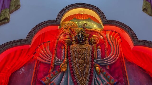 Dwarkadhish, the royal form of Lord Krishna as the King of Dwarka, richly adorned with ornate jewelry, layered garlands, and traditional ceremonial attire.