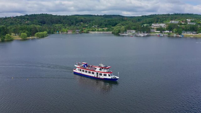 Roating Drone shot of boat cruising on lake in brno czech republic
