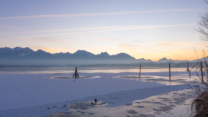 Sunset on Lake Hopfen in Bavaria Germany in Winter 2025 - Great Orange and Blue - Beautiful Alps with Great LIght and Ice - High quality photo