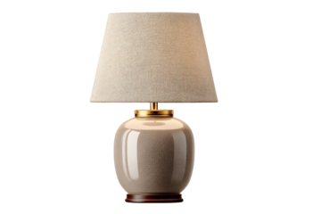 Elegant ceramic table lamp featuring a beige textured fabric shade and brass accents on transparent background