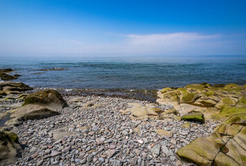 Rocky rugged coast of the Bay of Fundy at the Black Rock Lighthouse on the western side of Nova Scotis Canada