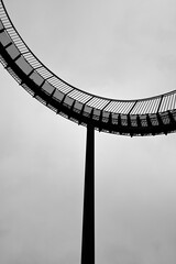 Stairway to heaven at the ruhr area. Black and white stairways. Isolated in front of cloudy sky.