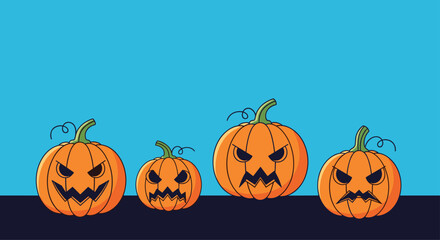Group of four carved orange pumpkins with spooky faces sitting on a dark ground against a clear blue sky for Halloween celebrations.