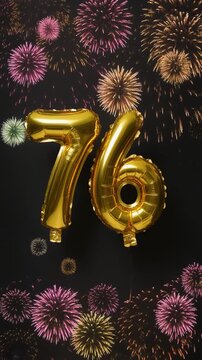 Gold balloon number 76 with fireworks in the background. Festive scene for birthday or anniversary party