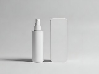White cosmetic spray bottle and rectangular packaging mockup standing side by side on a light gray surface