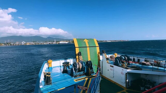 Bali, Indonesia - August 27, 2025: Car and passenger ferries cross the Bali Strait from Gilimanuk Harbor to Ketapang Harbor. View of the strait from the ferry deck. 4К