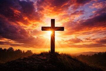 Wooden cross silhouette against dramatic sunset sky