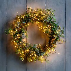 Illuminated green wreath with delicate white flowers and warm fairy lights