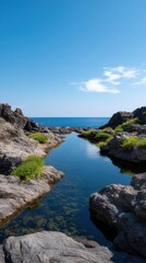 Natural Coral Pool Framed by Rocky Shoreline Under Clear Blue Sky