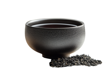 Elegant dark ceramic tea bowl rich warm brew beside aromatic premium loose on transparent background