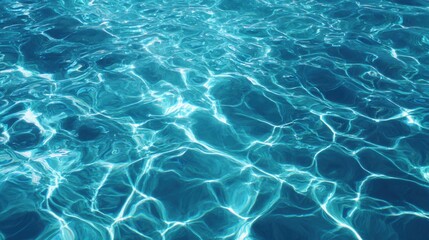 Sunlight reflecting on clear blue water surface for summer background. Natural abstract texture pattern with ripples and light for vacation. Clean transparent aqua backdrop.