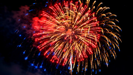 Vibrant fireworks explosion isolated on white background