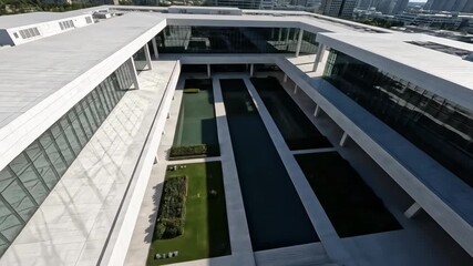 Modern office building in Hong Kong featuring contemporary architectural design and sleek glass facades under a clear sky