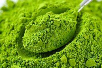 Close-Up Scoop of Vibrant Green Matcha Tea Powder on Textured