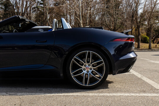 March 16, 2021, Seoul, South Korea - A dark blue Jaguar F-Type convertible sports car parked in an outdoor parking lot.