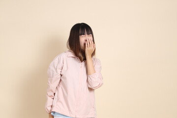 20s Asian woman in pink UV jacket