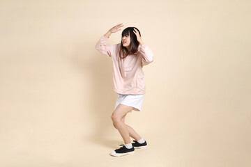 20s Asian woman in pink UV jacket