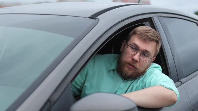Conflict. Man in a car. Slow motion.High quality 4k footage