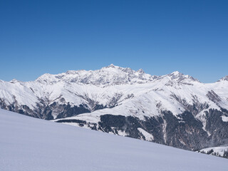 Fototapeta premium Praettigau, Switzerland - February 15th 2025: Amazing panorama of an alpine winter landscape