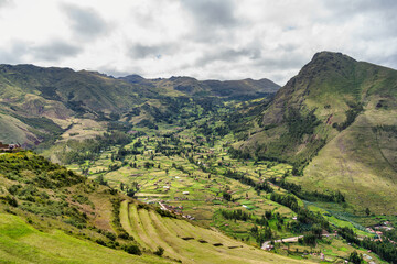 Fototapeta premium Scenic view overlooking the lush green landscape of the Sacred Valley of the Incas. View from Pisac Archaeological Site