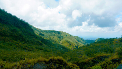 Obraz premium Lush Green Slopes and Ridges of Mount Kelud Highlands