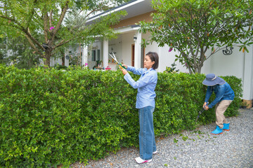 A collection of lifestyle images featuring a cheerful Asian man and woman spending time together in their backyard garden.