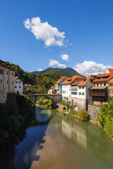 Explore the historic city center of Skofja Loka, where medieval architecture meets nature along a scenic Sora river.