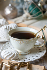 Obraz premium On the table there is New Year's tea 2026, coffee, gingerbread and pine cone cookies.