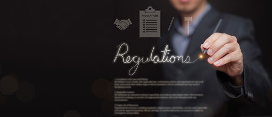Business regulations concept. Man with professional writing regulation text, representing legal compliance, corporate governance, policy implementation, regulatory frameworks, company law management.