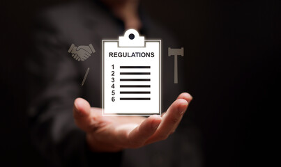 Business regulations and compliance concept. Legal checklist clipboard with governance and agreement icons above man hand, symbolizing corporate rules, policy, law, and risk management and control.