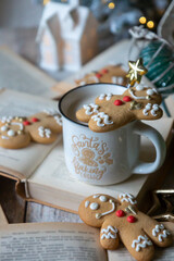 On the table there is New Year's tea 2026, coffee, gingerbread and pine cone cookies.