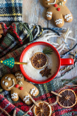 On the table there is New Year's tea 2026, coffee, gingerbread and pine cone cookies.
