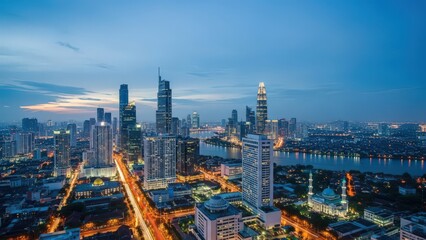 Fototapeta premium Stunning Twilight Cityscape with Illuminated Skyscrapers and Busy Roads.