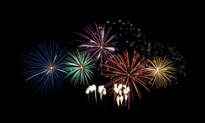 Festive colorful fireworks display isolated on black background for celebration and anniversary