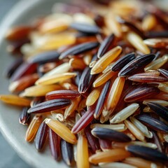 Colorful wild rice grains on a gray ceramic plate