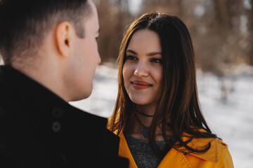Couple enjoying an intimate moment outdoors during winter