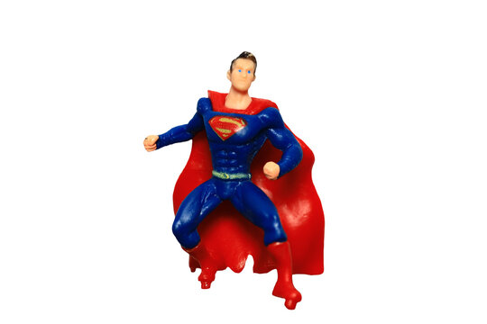 A superhero action figure standing on a clean white surface, ideal for use in illustrations and graphics