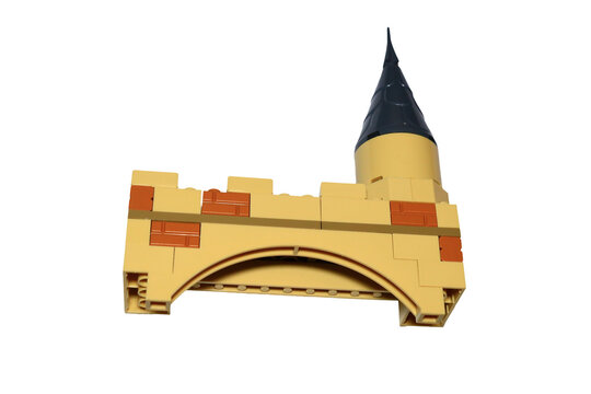 A miniature Lego castle with a large clock on the top, great for illustrations and designs