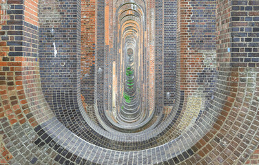 Semi-circular arches vaulting supporting brick piers, composed of traditional red bricks topped with smooth limestone and has been described as &acirc;the most elegant viaduct in Britain&acirc; Architectural