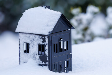 Small house lantern covered with snow in winter
