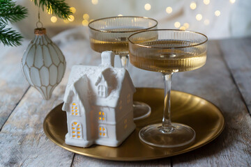 New Year 2026: champagne and Christmas tree decorations on the table.